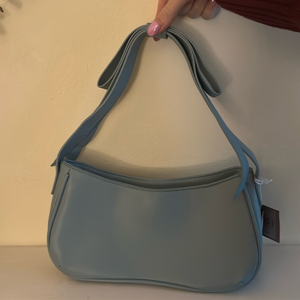 Powder blue shoulder bag with bow detail on strap. Excellent condition with tags - Picture 2 of 6